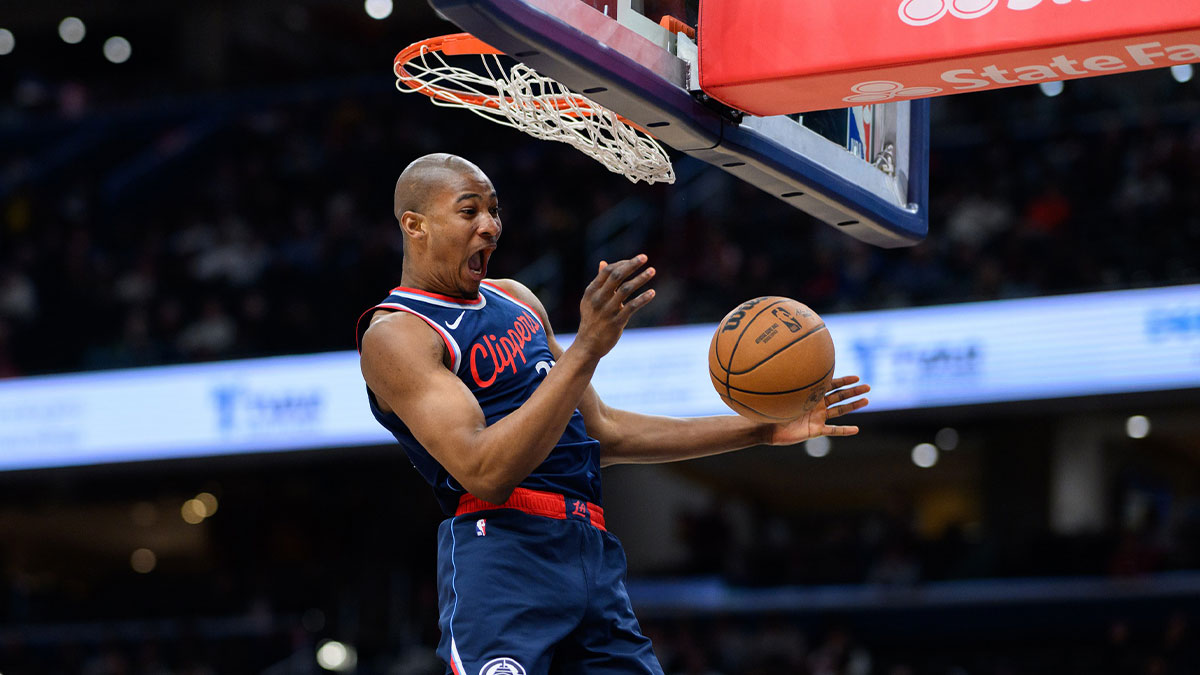 Clippers forward Kai Jones (23) dunks the ball during the fourth quarter against the Washington Wizards at Capital One Arena with the Heat and Hornets logos in the background