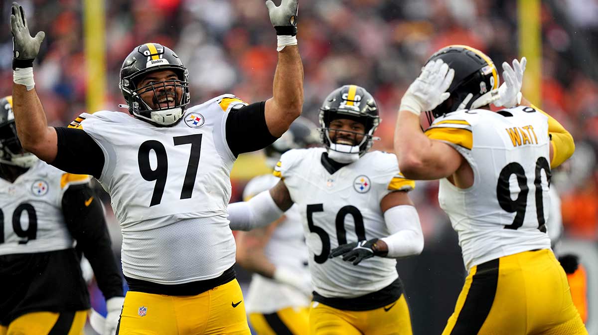 Pittsburgh Steelers defensive tackle Cameron Heyward (97) and Pittsburgh Steelers linebacker T.J. Watt (90) celebrate a sack of Cincinnati Bengals quarterback Jake Browning (6) in the fourth quarter at Paycor Stadium.