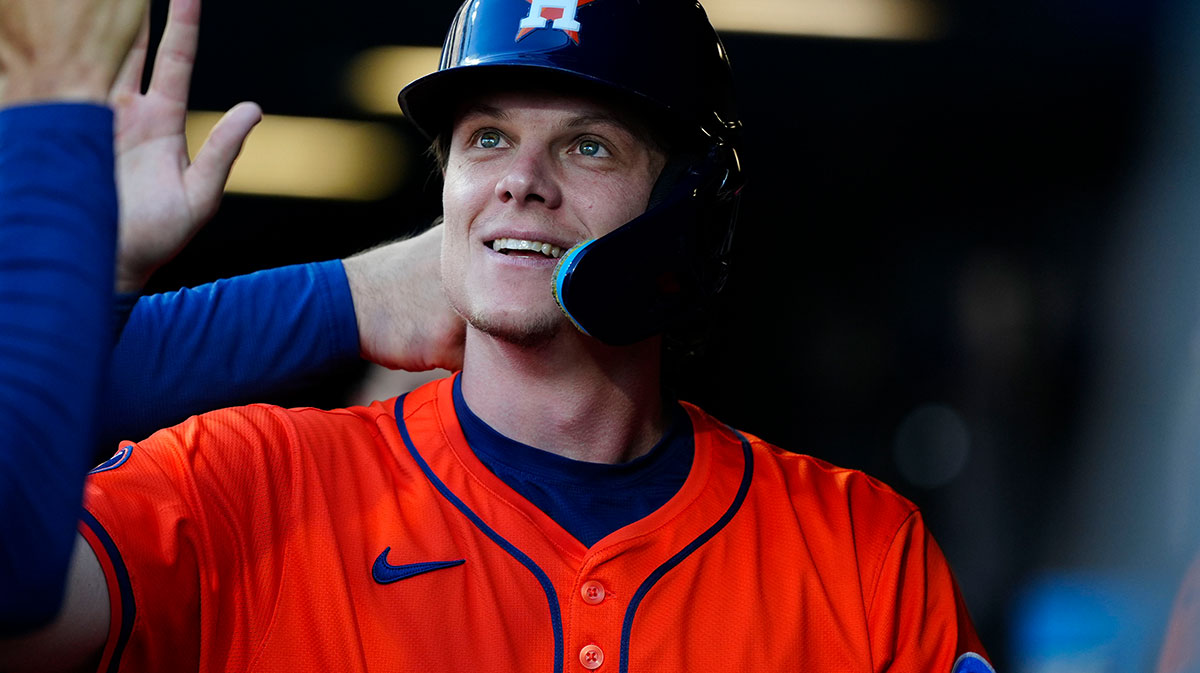 Houston Astros center fielder Jake Meyers (6) celebrates scoring a run the first inning against the Colorado Rockies at Coors Field.