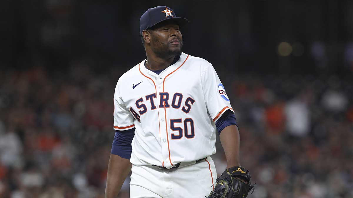 Houston Astros relief pitcher Hector Neris (50) walks off the field during the eighth inning against the Cleveland Guardians at Daikin Park.