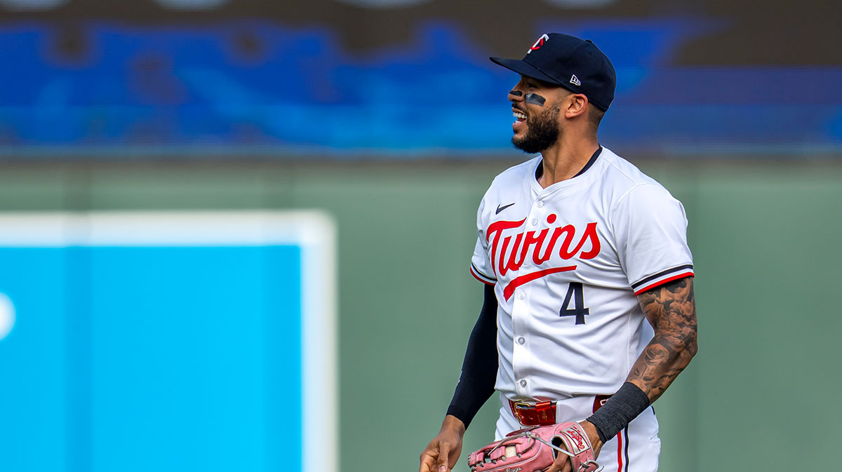 Minnesota Twins shortstop Carlos Correa (4) smiles after Minnesota Twins third baseman Brooks Lee (not pictured) catches a fly ball against the Seattle Mariners in the first inning at Target Field.