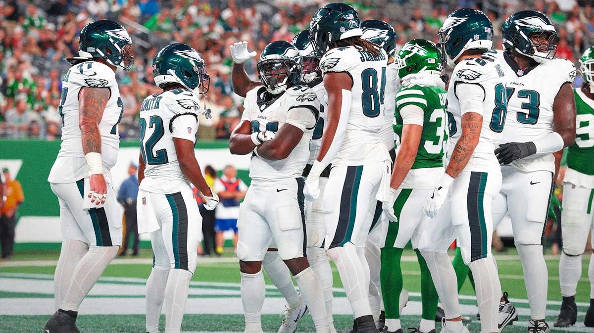 Philadelphia Eagles running back Montrell Johnson Jr. (34) celebrates his rushing touchdown with teammates during the second half against the New York Jets at MetLife Stadium.