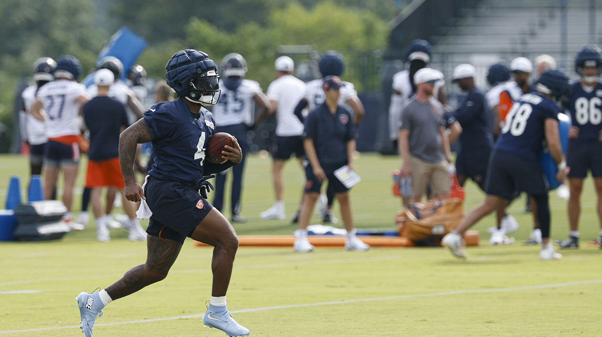Jul 24, 2025; Lake Forest, IL, USA; Chicago Bears running back D'Andre Swift (4) runs with the ball during training camp at Halas Hall. Mandatory Credit: Kamil Krzaczynski-Imagn Images