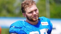 Detroit Lions Edge Aidan Hutchinson walks off the field during the joint practice with the Miami Dolphins at the Lions headquarters and training facility in Allen Park, Thursday, Aug. 14 2025