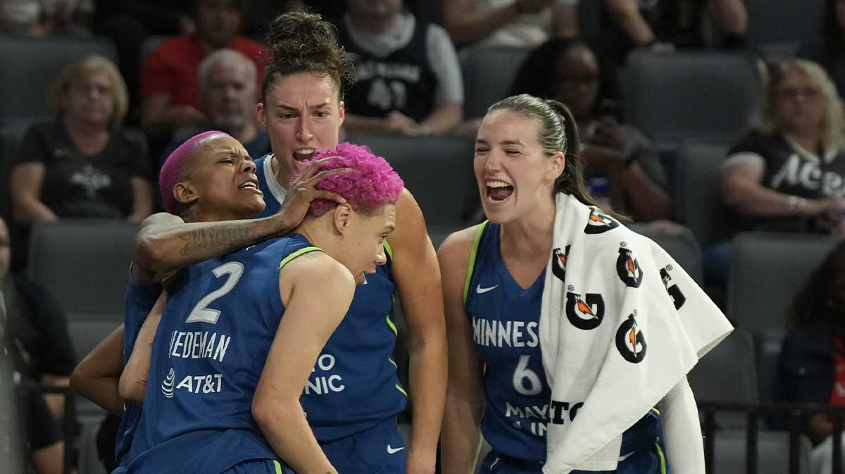 Minnesota Lynx guard Courtney Williams (10), forward Jessica Shepard (15) and forward Bridget Carleton (6) celebrates a blocked shot by guard Natisha Hiedeman (2) against the Las Vegas Aces during the fourth quarter of their game at Michelob Ultra Arena.