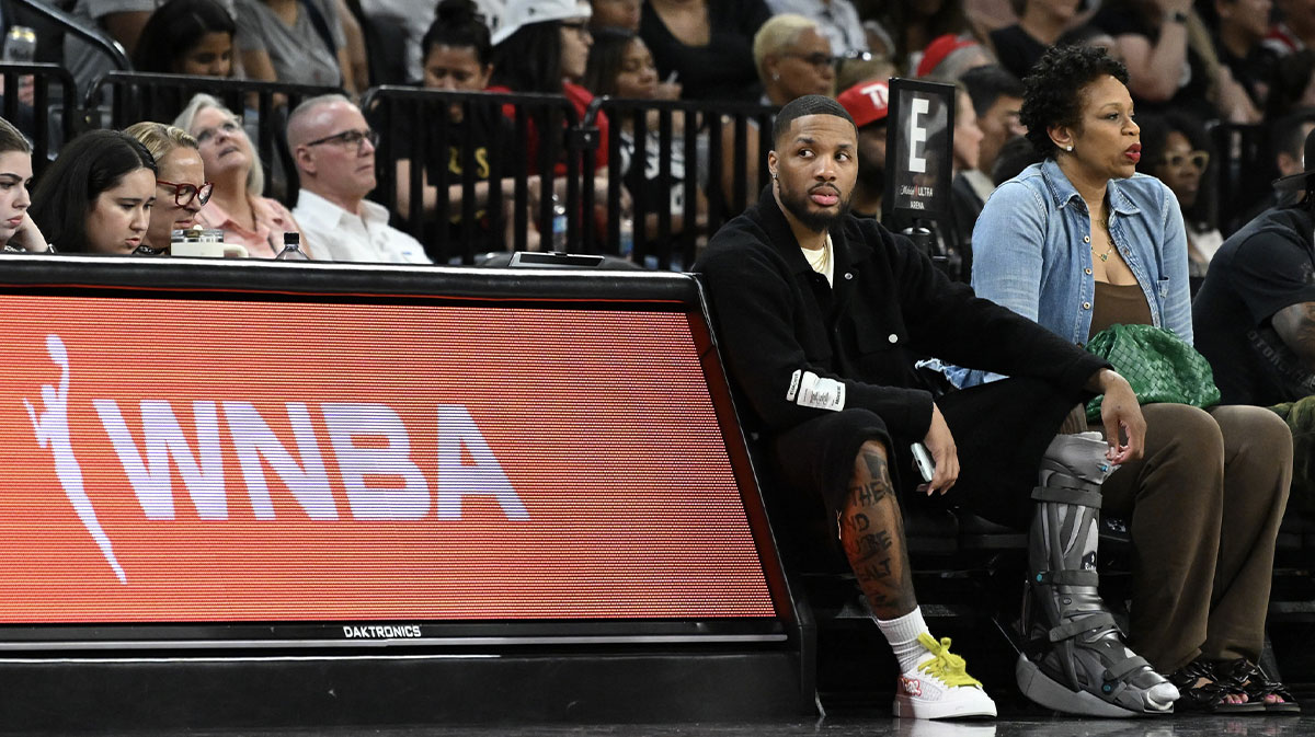 NBA player Damian Lillard sits courtside during the Las Vegas Aces and Los Angeles Sparks game at Michelob Ultra Arena.