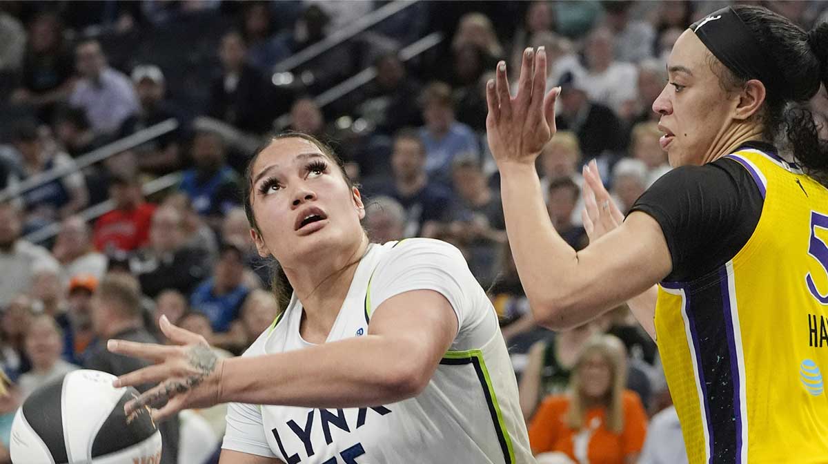 Minnesota Lynx forward Alissa Pili (35) goes to the basket against Los Angeles Sparks forward Dearica Hamby (5) in the fourth quarter at Target Center.