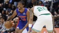 Detroit Pistons guard Daniss Jenkins (24) dribbles defended by Boston Celtics guard JD Davison (20) in the second half at Little Caesars Arena.