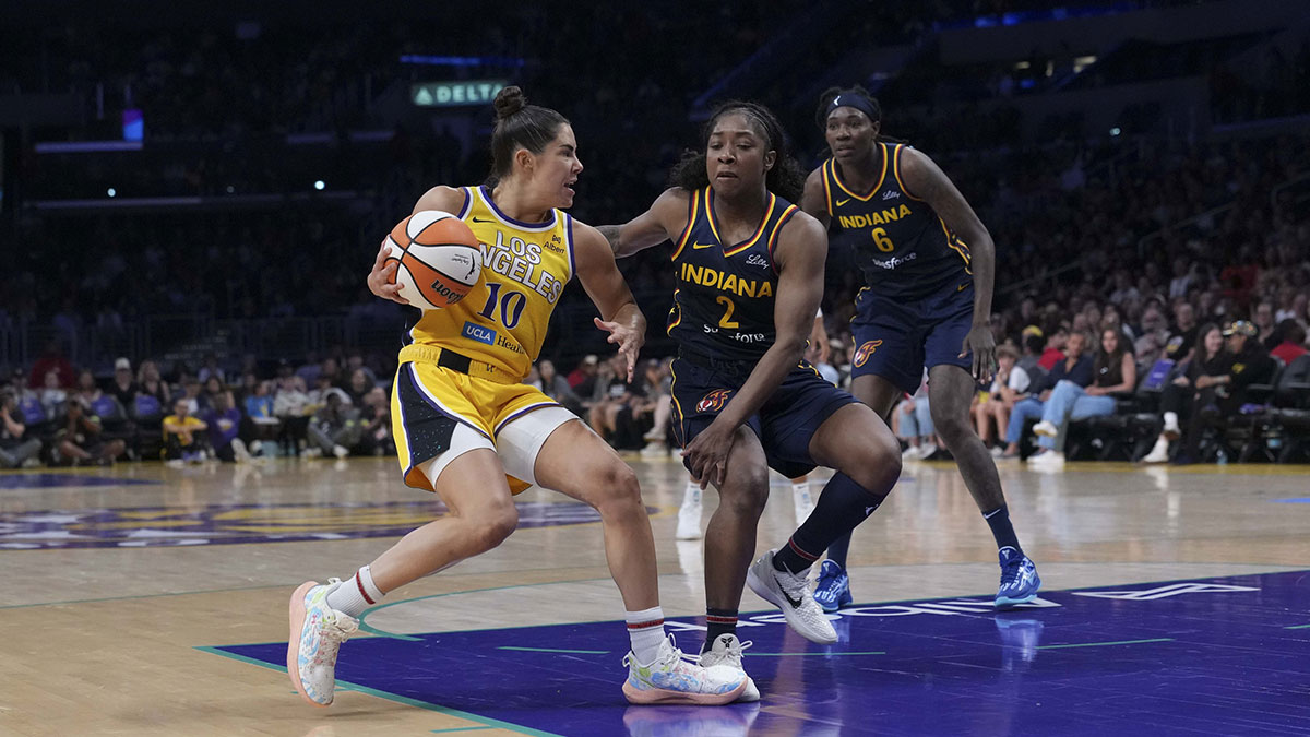 LA Sparks guard Kelsey Plum (10) drives to the basket while defended by Indiana Fever guard Aari McDonald (2) in the first half at Crypto.com Arena.