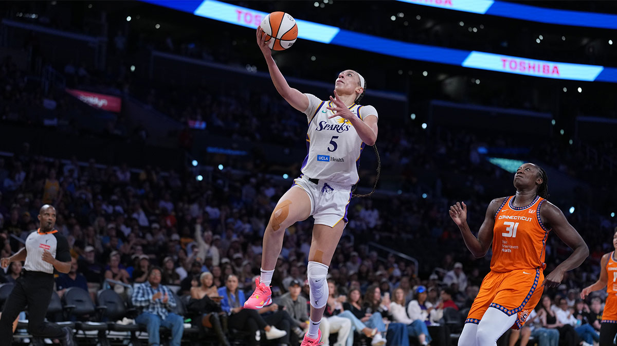 LA Sparks forward Dearica Hamby (5) goes up for a layup against the Connecticut Sun in the second half at Crypto.com Arena.