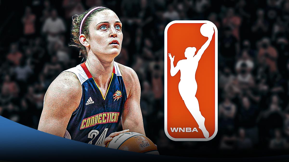 Former WNBA player Kelly Farris in her Connecticut Sun jersey with the WNBA logo in the background, Basketball Without Borders