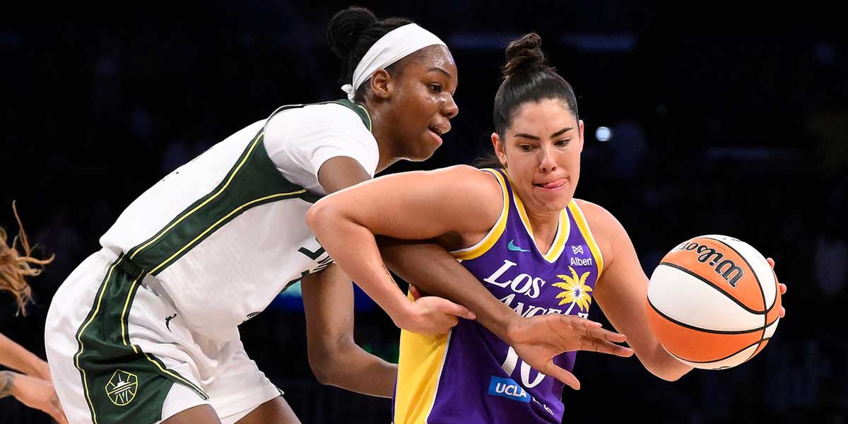 Los Angeles Sparks guard Kelsey Plum (10) drives to the basket defended by Seattle Storm forward Ezi Magbegor (13) during the second quarter at Crypto.com Arena.