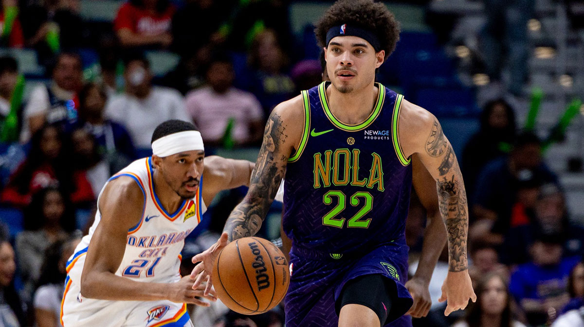 New Orleans Pelicans guard Lester Quinones (22) dribbles against Oklahoma City Thunder guard Aaron Wiggins (21) during the second half at Smoothie King Center.