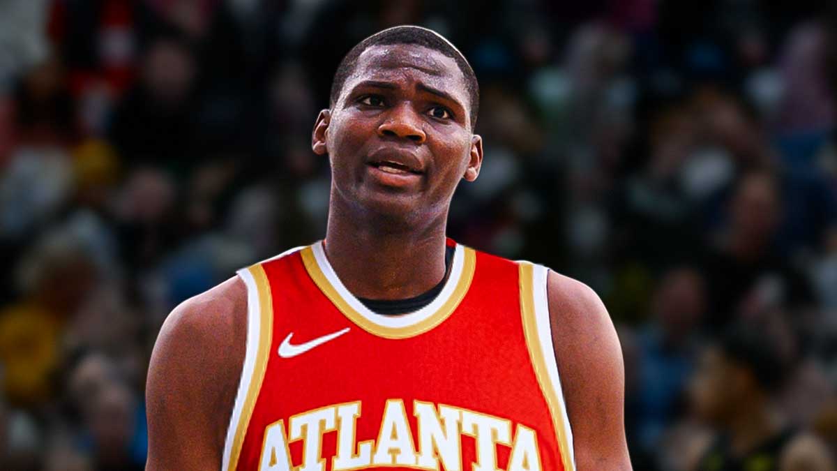 NBA player N’Faly Dante in an Atlanta Hawks jersey. Have the Hawks arena in the background, Rockets