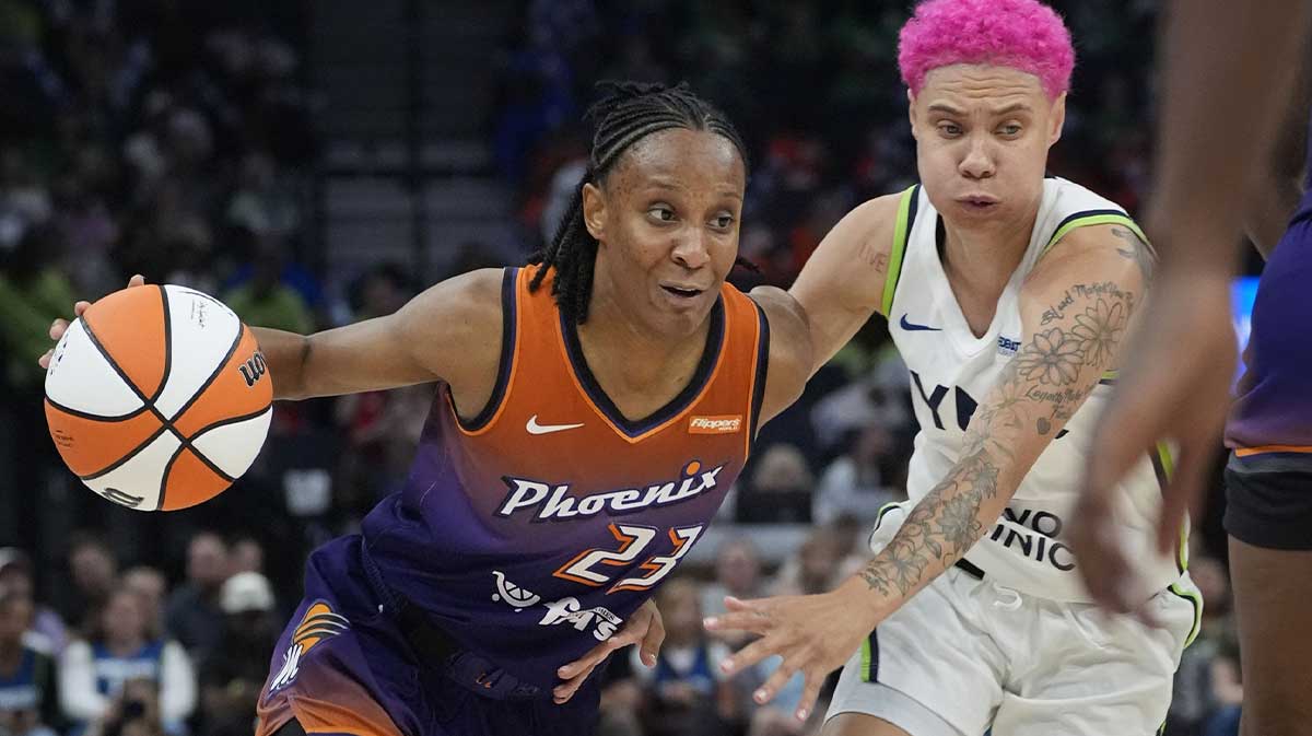 Phoenix Mercury guard Kiana Williams (23) drives around Minnesota Lynx guard Natisha Hiedeman (2) in the fourth quarter at Target Center.
