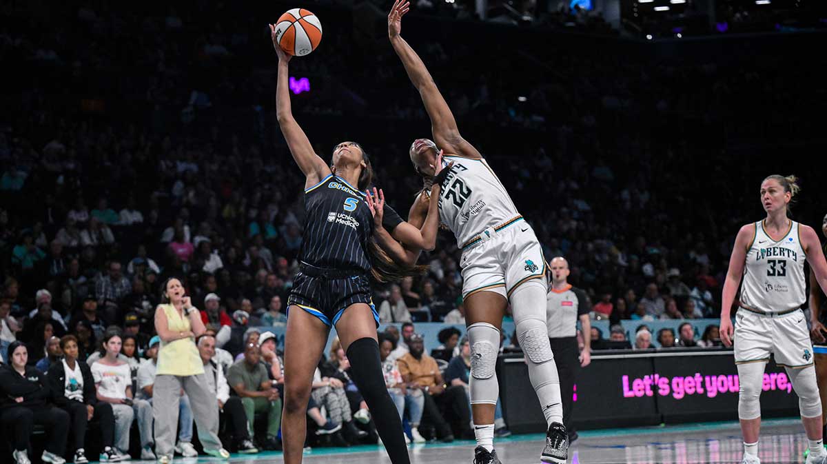 Chicago Sky forward Angel Reese (5) receives a pass in the low post as New York Liberty forward Kennedy Burke (22) defends during the first half at Barclays Center.