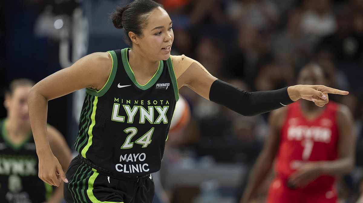 Minnesota Lynx forward Napheesa Collier (24) points to the bench after making a three point shot against the Indiana Fever in the second half at Target Center.