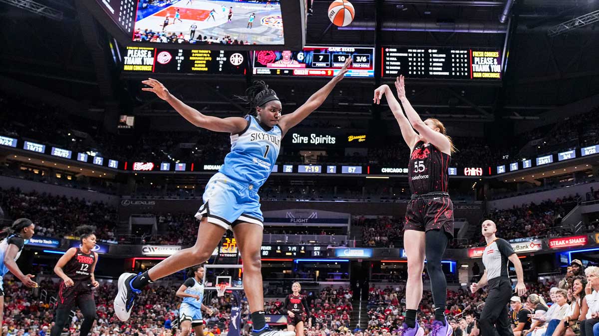 Indiana Fever forward Chloe Bibby (55) attempts a 3-pointer against Chicago Sky center Elizabeth Williams (1) on Saturday, Aug. 9, 2025, during a game between the Indiana Fever and the Chicago Sky at Gainbridge Fieldhouse in Indianapolis.