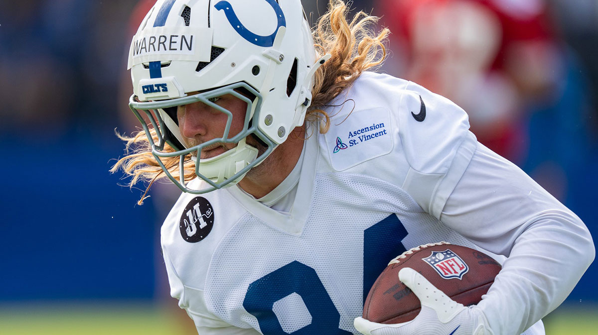 Indianapolis Colts tight end Tyler Warren (84) runs after catching a pass Friday, July 25, 2025, during training camp held at Grand Park in Westfield
