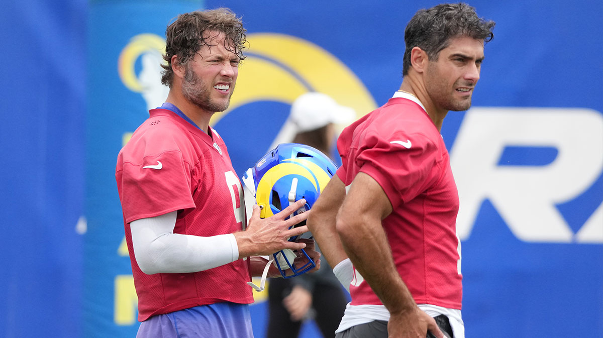 Los Angeles Rams quarterbacks Matt Stafford (9) and Jimmy Garroppolo (11) take a break during organized team activities at Rams Practice Facility.