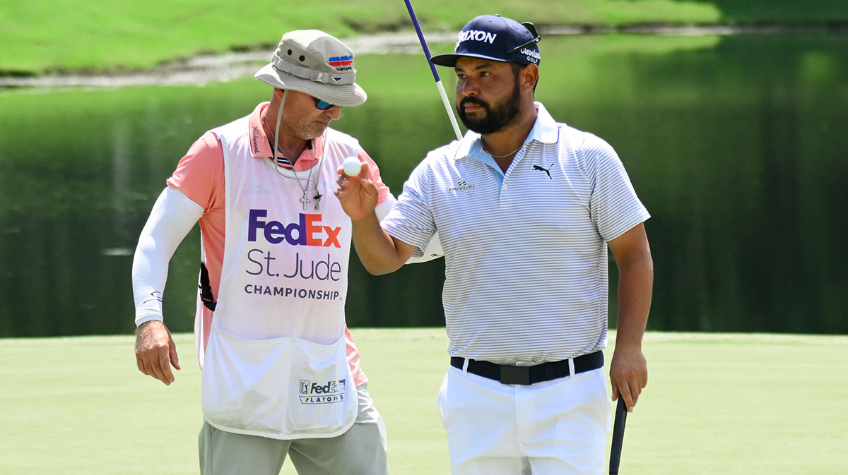 J.J. Spaun waves to crowd after sinking a birdie putt during the final round of the FedEx St. Jude Championship golf.