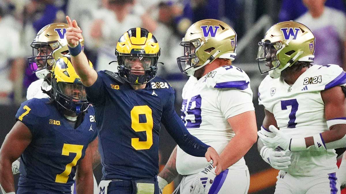 Michigan quarterback J.J. McCarthy points down the field during the second half of the College Football Playoff national championship game against Washington at NRG Stadium
