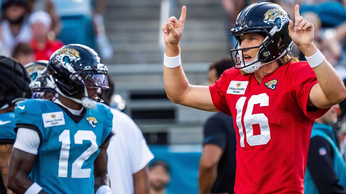 Jacksonville Jaguars quarterback Trevor Lawrence (16) calls a play with teammate wide receiver Travis Hunter (12) in the background before an NFL scrimmage at EverBank Stadium Friday August 1, 2025, in Jacksonville, Fla.