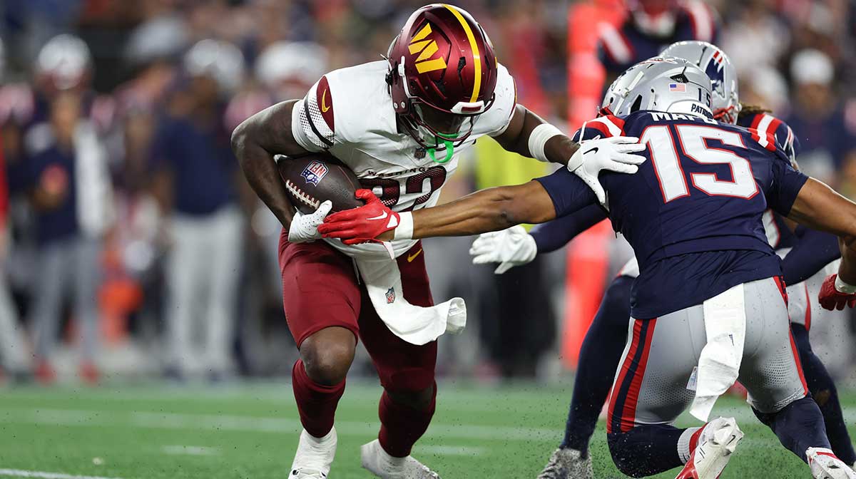 Aug 8, 2025; Foxborough, Massachusetts, USA; Washington Commanders running back Jacory Croskey-Merritt (32) runs the ball during the first half