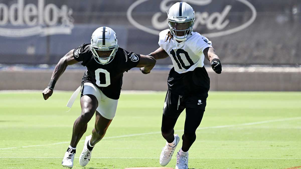 Las Vegas Raiders cornerback Jakorian Bennett (0) and wide receiver Dont'e Thornton Jr. (10) run through a drill during Las Vegas Raiders Minicamp at Intermountain Health Performance Center.