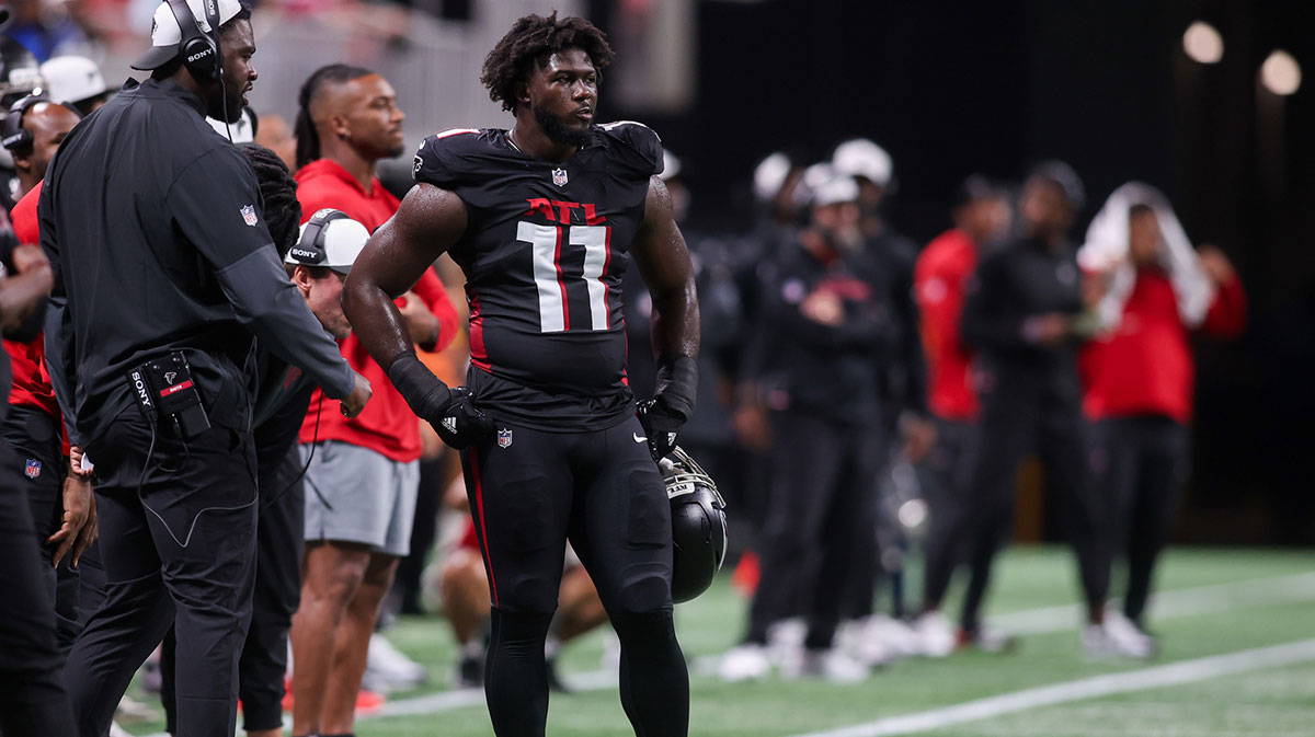 Atlanta Falcons linebacker Jalon Walker (11) on the sideline against the Detroit Lions in the second quarter at Mercedes-Benz Stadium.