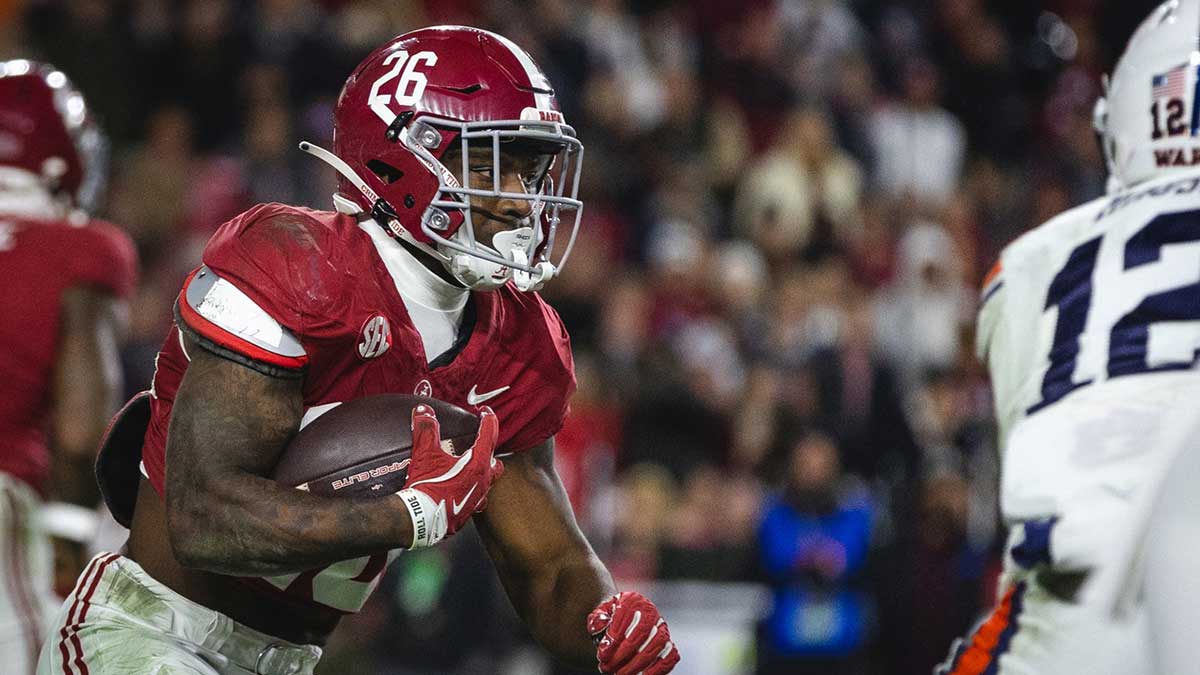 Alabama Crimson Tide running back Jam Miller (26) runs the ball against the Auburn Tigers during the third quarter at Bryant-Denny Stadium.