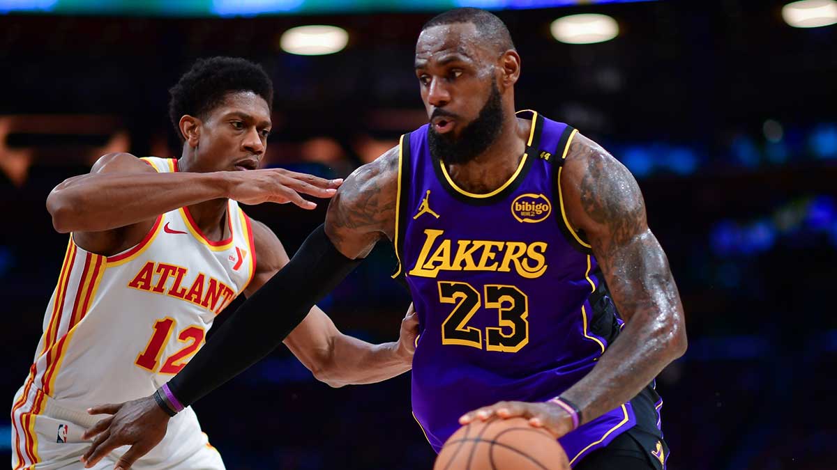 Los Angeles Lakers forward LeBron James (23) moves the ball against Atlanta Hawks forward De'Andre Hunter (12) during the second half at Crypto.com Arena.