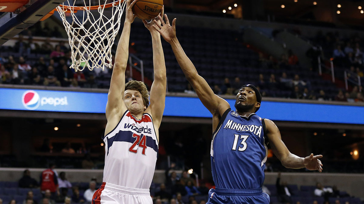 Washington Wizards power forward Jan Vesely (24) dunks the ball as Minnesota Timberwolves small forward Corey Brewer (13) defends in the second quarter at Verizon Center.