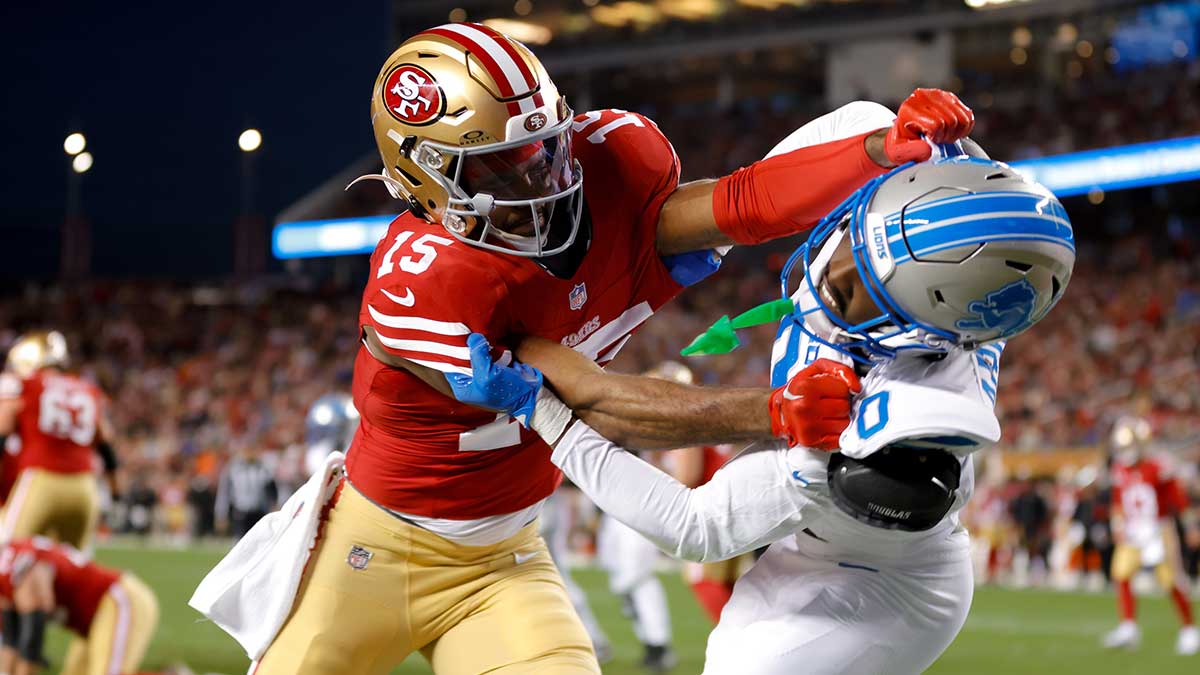 San Francisco 49ers wide receiver Jauan Jennings (15) and Detroit Lions cornerback Terrion Arnold (0) get tangled after a play during the first quarter at Levi's Stadium