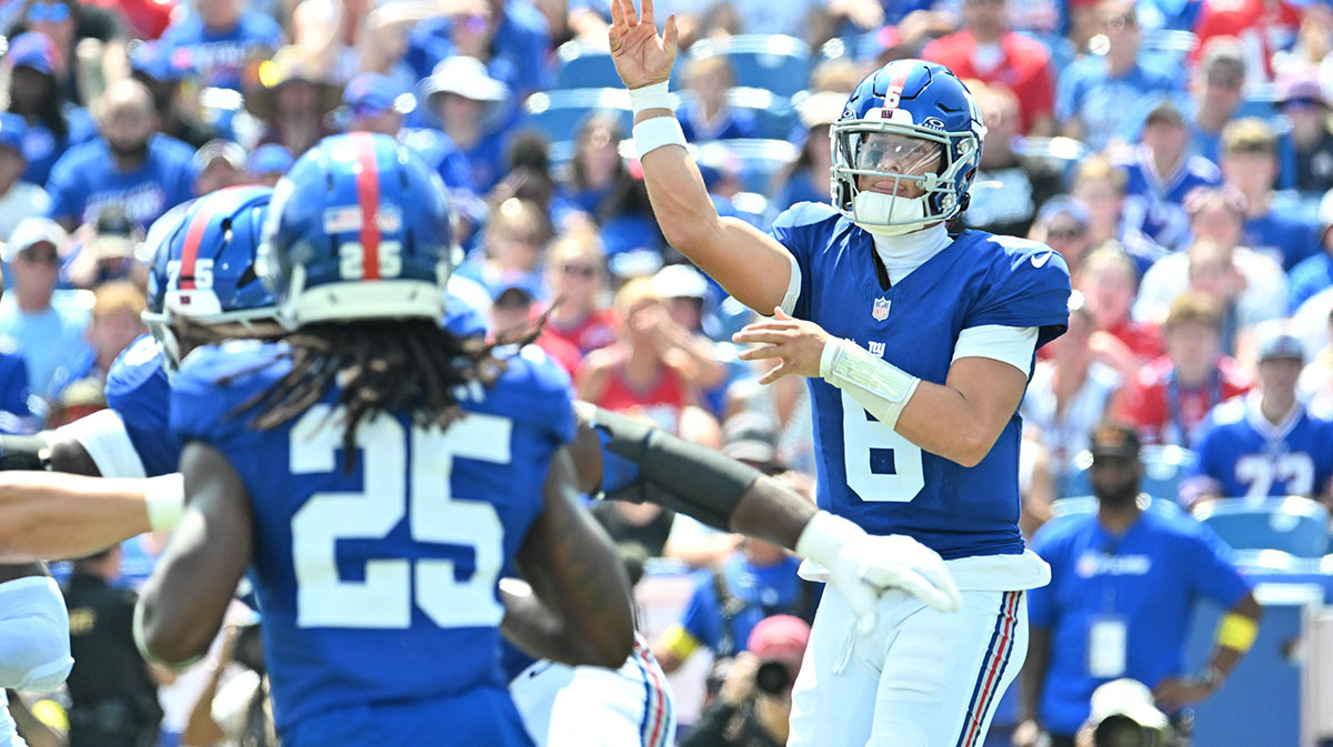 New York Giants quarterback Jaxson Dart (6) throws a pass to running back Dante Miller (25) in the second quarter game against the Buffalo Bills at Highmark Stadium.