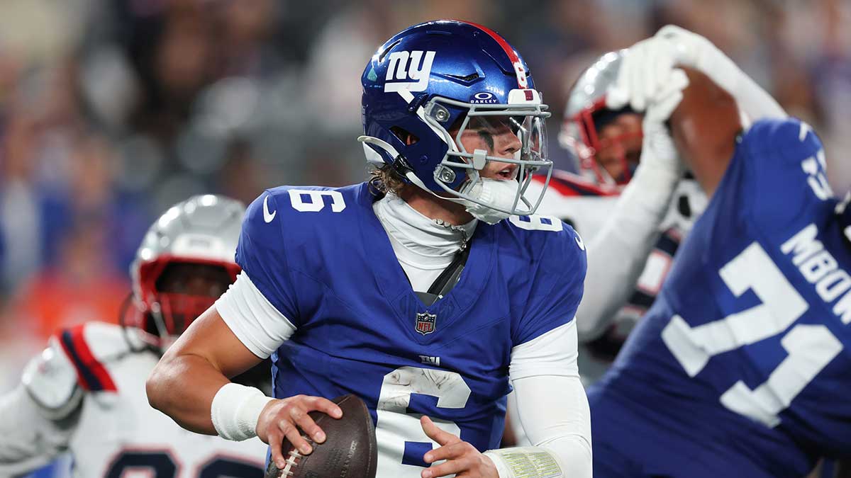 New York Giants quarterback Jaxson Dart (6) drops back to pass during the first half against the New England Patriots at MetLife Stadium.