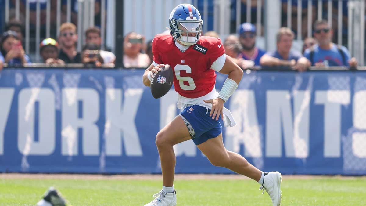 New York Giants quarterback Jaxson Dart (6) scrambles during training camp at Quest Diagnostics Training Center.
