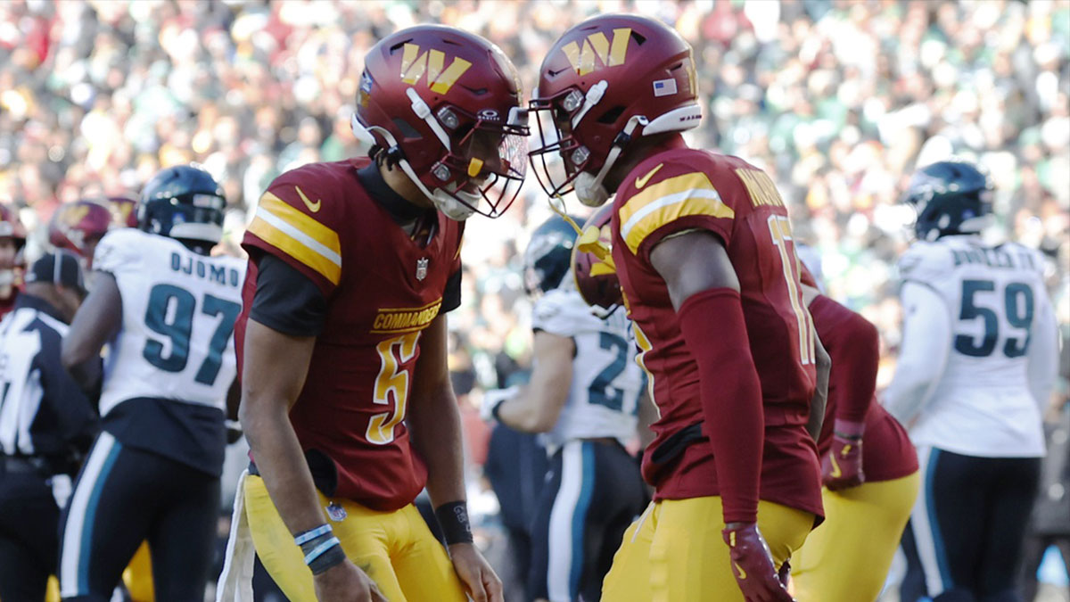 Washington Commanders quarterback Jayden Daniels (5) celebrates with Commanders wide receiver Terry McLaurin (17) after connecting on a touchdown pass against the Philadelphia Eagles during the second quarter at Northwest Stadium.