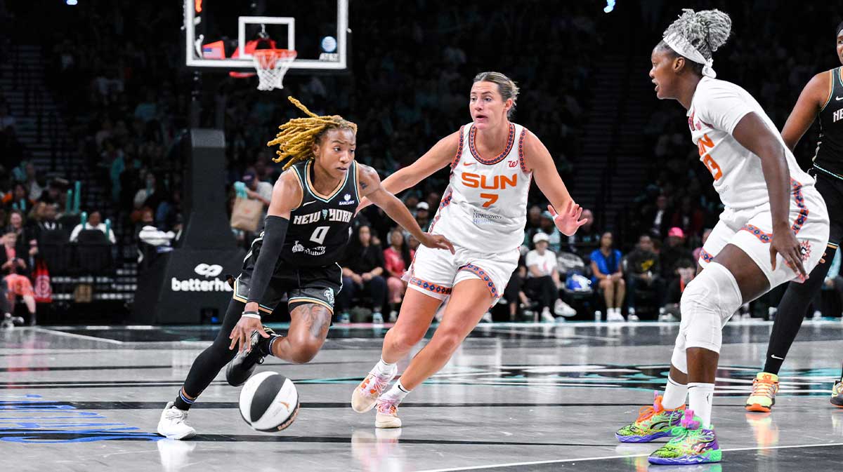 New York Liberty guard Jaylyn Sherrod (0) drives to the basket while being defended by Connecticut Sun forward Haley Peters (7) and center Kariata Diaby (23) during the second half at Barclays Center.