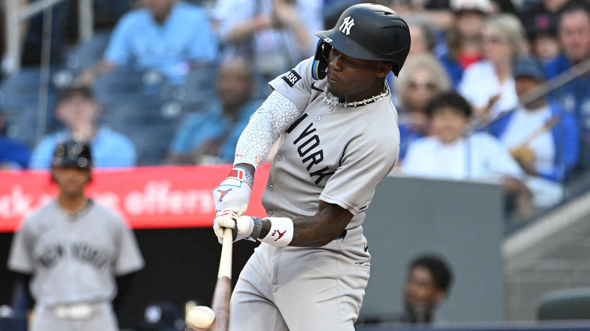 Jul 22, 2025; Toronto, Ontario, CAN; New York Yankees second baseman Jazz Chisholm Jr. (13) hits a three run home run against the Toronto Blue Jays in the first inning at Rogers Centre.