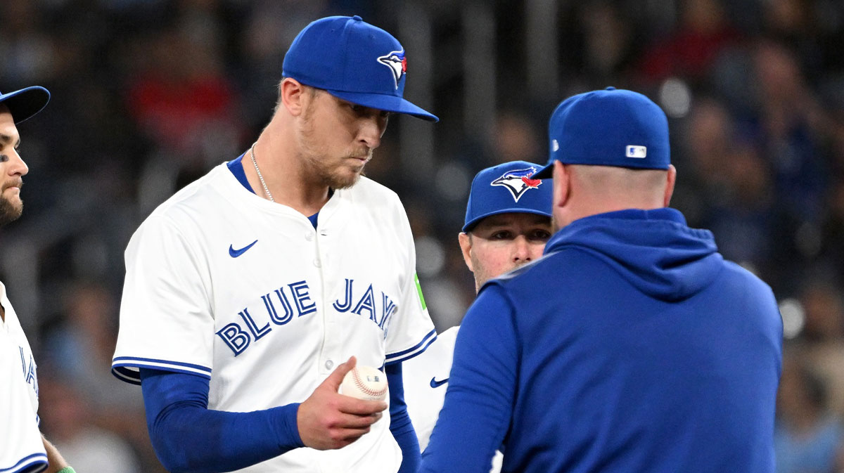 Toronto Blue Jays relief pitcher Jeff Hoffman (23) is relieved by manager John Schneider (14) in the ninth inning against the Minnesota Twins at Rogers Centre.