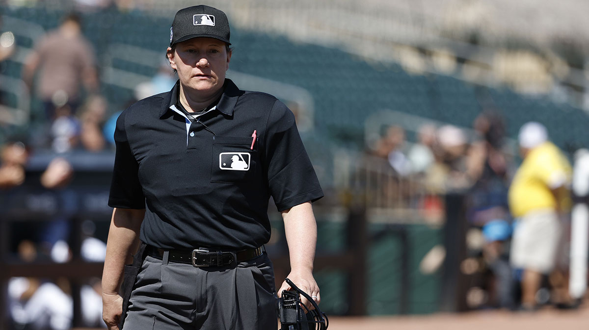 Umpire Jen Pawol walks to the plate prior to the game between the Washington Nationals and the Miami Marlins at Roger Dean Chevrolet Stadium.