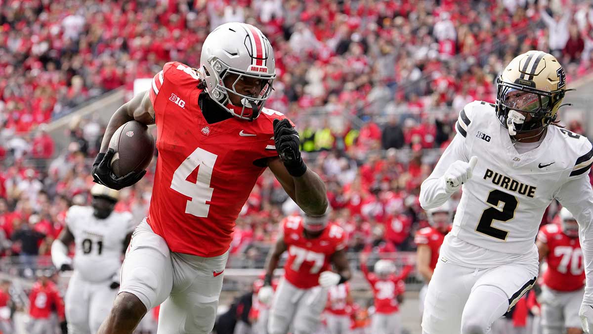 Ohio State Buckeyes wide receiver Jeremiah Smith (4) dances into the end zone untouched by Purdue Boilermakers defensive back Nyland Green (2) during the first half at Ohio Stadium.