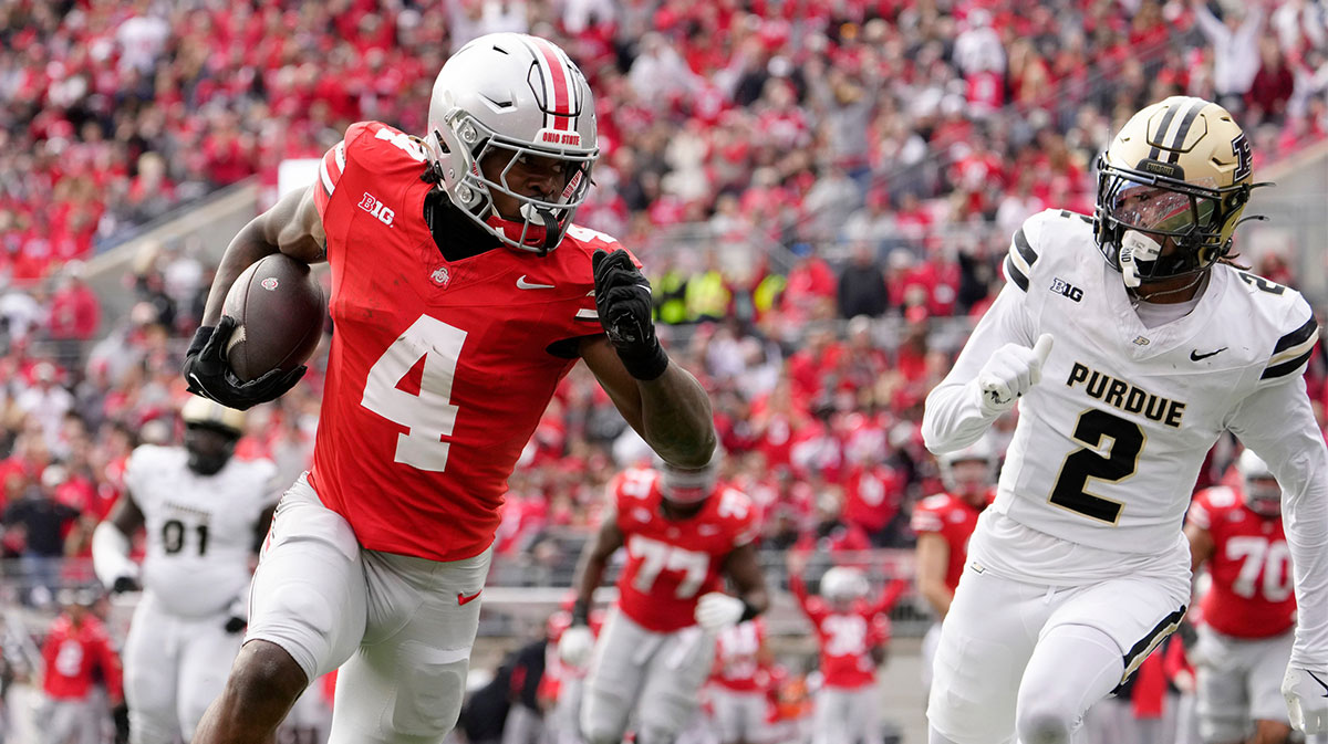 Ohio State Buckeyes wide receiver Jeremiah Smith (4) dances into the end zone untouched by Purdue Boilermakers defensive back Nyland Green (2) during the first half at Ohio Stadium.