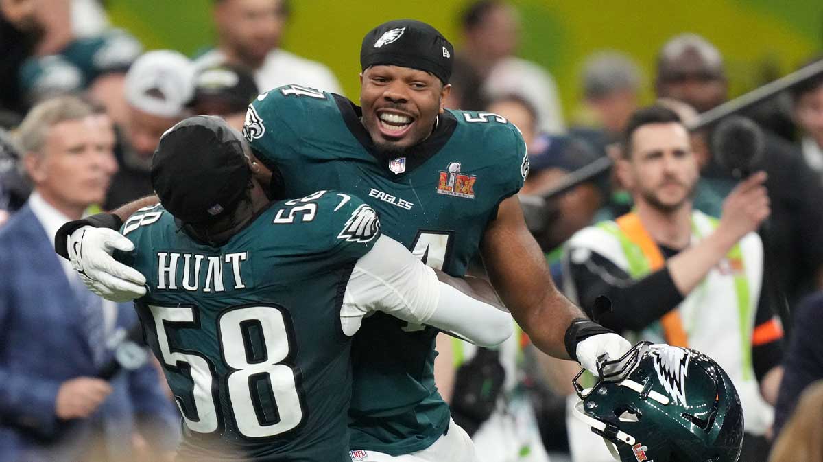 Philadelphia Eagles linebacker Jeremiah Trotter Jr. (54) reacts with linebacker Jalyx Hunt (58) after defeating the Kansas City Chiefs in Super Bowl LIX at Caesars Superdome.