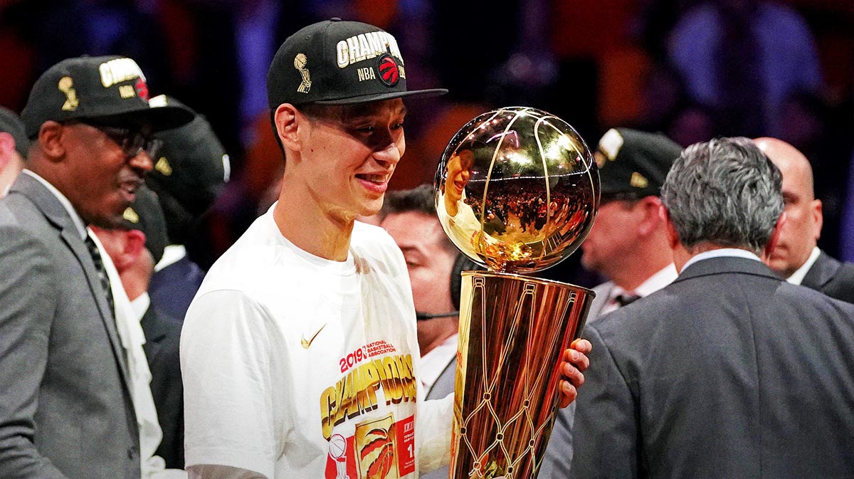 Toronto Raptors guard Jeremy Lin (17) celebrates with the Larry O'Brian Trophy after beating the Golden State Warriors in game six of the 2019 NBA Finals at Oracle Arena.