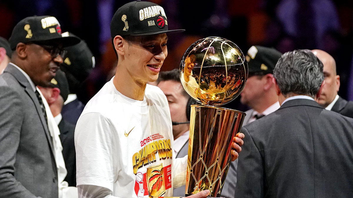 Toronto Raptors guard Jeremy Lin (17) celebrates with the Larry O'Brian Trophy after beating the Golden State Warriors in game six of the 2019 NBA Finals at Oracle Arena.