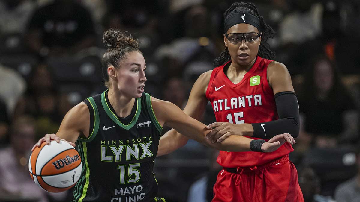 Minnesota Lynx forward Jessica Shepard (15) dribbles defended by Atlanta Dream guard Allisha Gray (15) during the first half at Gateway Center Arena at College Park.