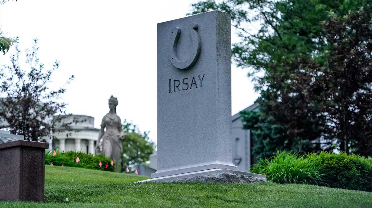 Flowers lay in the Irsay family grave on the crown at Crown Hill Cemetery the day after Indianapolis Colts Owner Jim Irsay passes away