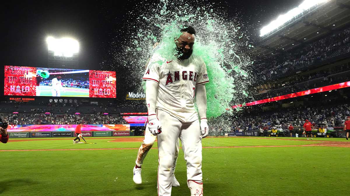 Los Angeles Angels right fielder Jo Adell (7) is doused after hitting a walk-off single in the 10th inning against the Los Angeles Dodgers at Angel Stadium.